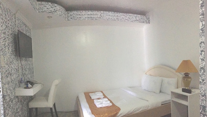 Imagen de la habitación del Hotel RedDoorz Premium at THE GRAND PENINSULA SUITES. Foto 17