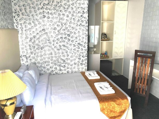 Imagen de la habitación del Hotel RedDoorz Premium at THE GRAND PENINSULA SUITES. Foto 20