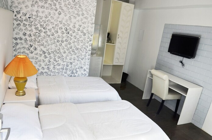 Imagen de la habitación del Hotel RedDoorz Premium at THE GRAND PENINSULA SUITES. Foto 23
