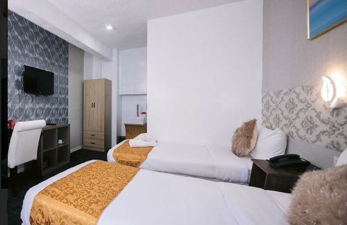 Imagen de la habitación del Hotel RedDoorz Premium at THE GRAND PENINSULA SUITES. Foto 24