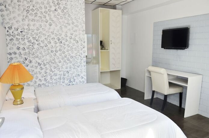 Imagen de la habitación del Hotel RedDoorz Premium at THE GRAND PENINSULA SUITES. Foto 26