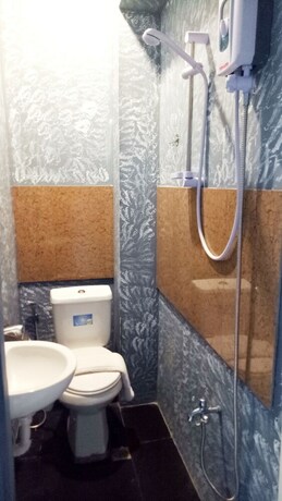Imagen de la habitación del Hotel RedDoorz Premium at THE GRAND PENINSULA SUITES. Foto 27