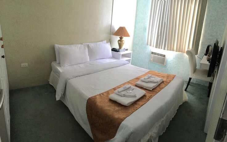 Imagen de la habitación del Hotel RedDoorz Premium at THE GRAND PENINSULA SUITES. Foto 28