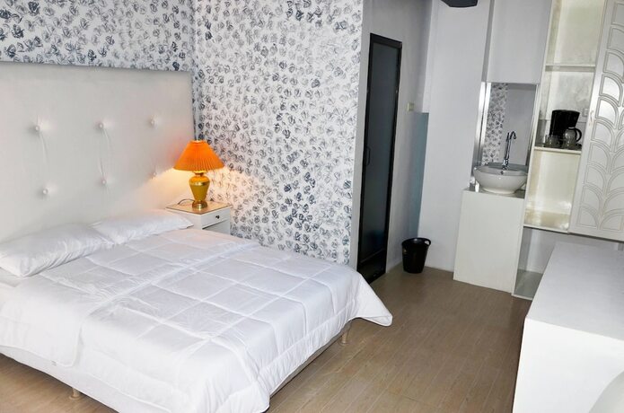 Imagen de la habitación del Hotel RedDoorz Premium at THE GRAND PENINSULA SUITES. Foto 37