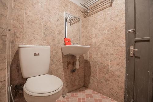 Imagen de la habitación del Hotel RedDoorz Syariah at Grand Taufiq Tarakan. Foto 5