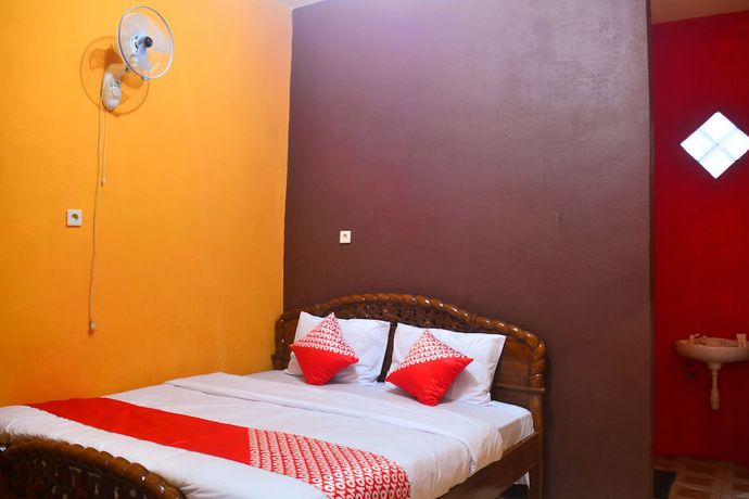Imagen de la habitación del Hotel RedDoorz at Rita Guesthouse Pangandaran. Foto 2