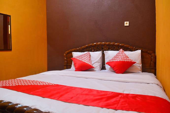 Imagen de la habitación del Hotel RedDoorz at Rita Guesthouse Pangandaran. Foto 3