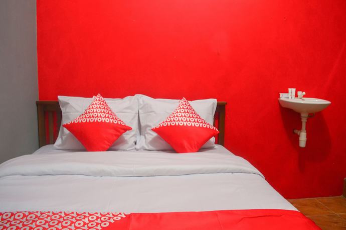Imagen de la habitación del Hotel RedDoorz at Rita Guesthouse Pangandaran. Foto 7