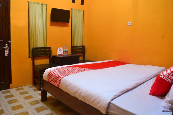 Imagen de la habitación del Hotel RedDoorz at Rita Guesthouse Pangandaran. Foto 9