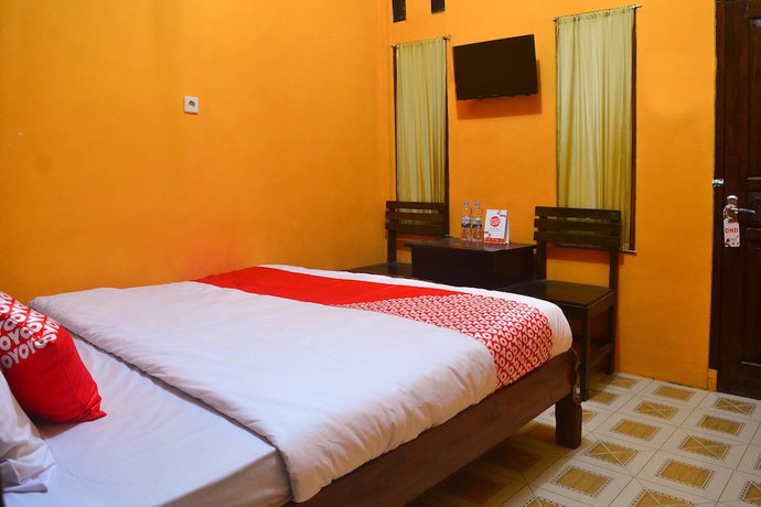 Imagen de la habitación del Hotel RedDoorz at Rita Guesthouse Pangandaran. Foto 10