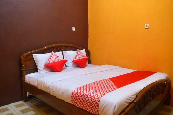 Imagen de la habitación del Hotel RedDoorz at Rita Guesthouse Pangandaran. Foto 11
