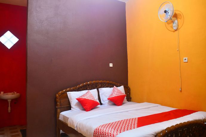 Imagen de la habitación del Hotel RedDoorz at Rita Guesthouse Pangandaran. Foto 13