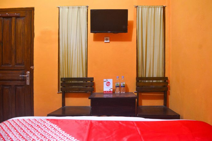 Imagen de la habitación del Hotel RedDoorz at Rita Guesthouse Pangandaran. Foto 14