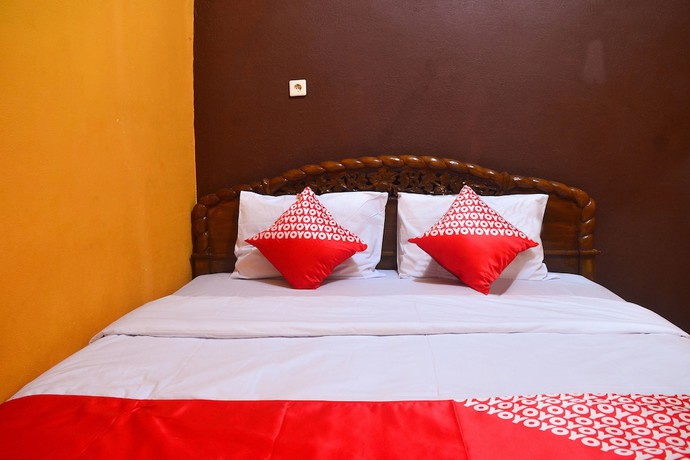 Imagen de la habitación del Hotel RedDoorz at Rita Guesthouse Pangandaran. Foto 15