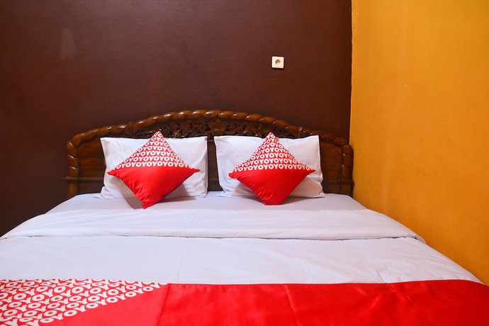 Imagen de la habitación del Hotel RedDoorz at Rita Guesthouse Pangandaran. Foto 17