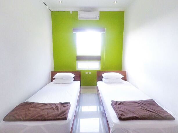 Imagen de la habitación del Hotel RedDoorz near Ubud Village. Foto 18