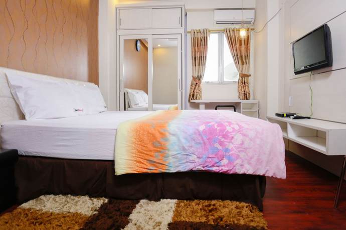 Imagen de la habitación del Hotel RedLiving Apartemen The Suites Metro - Mary Tower E. Foto 6