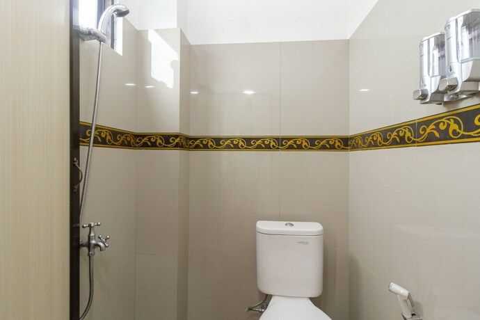 Imagen de la habitación del Hotel Reddoorz Near Rsu Suaka Insan. Foto 24