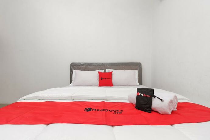 Imagen de la habitación del Hotel Reddoorz Near Rsu Suaka Insan. Foto 29
