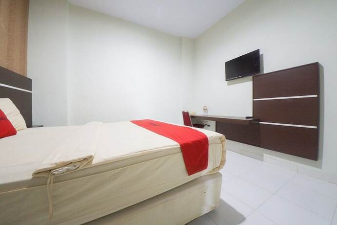 Imagen de la habitación del Hotel Reddoorz Plus Near Mall Panakukang 2. Foto 15