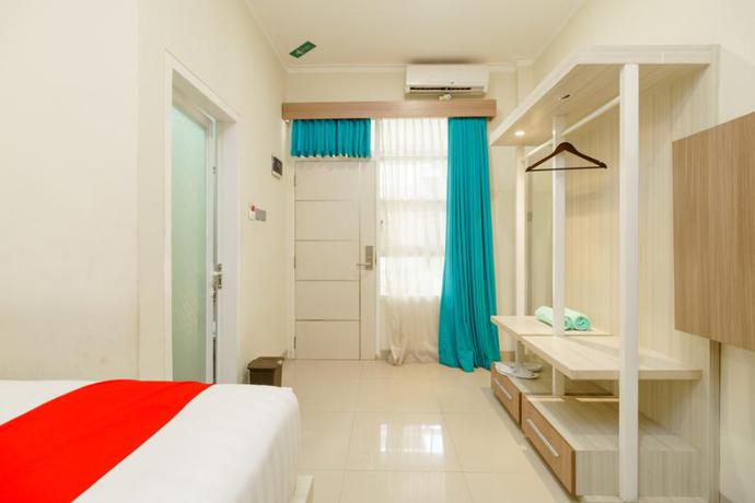 Imagen de la habitación del Hotel Reddoorz Plus @ Point Phila Cihampelas. Foto 8