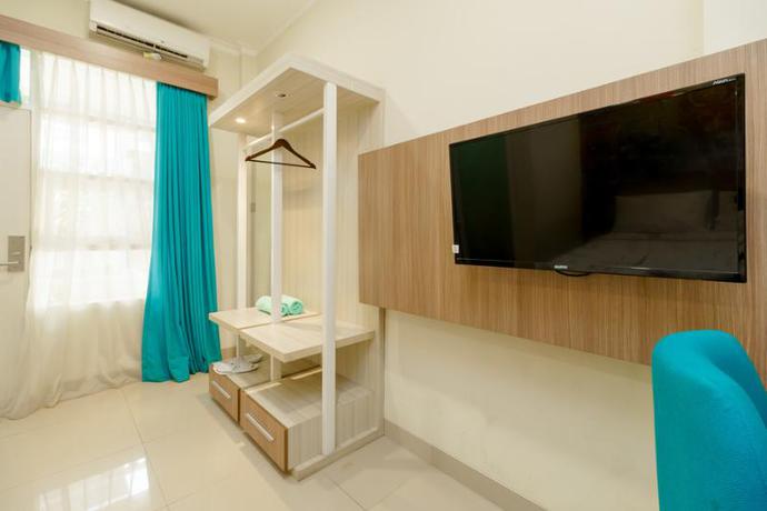 Imagen de la habitación del Hotel Reddoorz Plus @ Point Phila Cihampelas. Foto 9