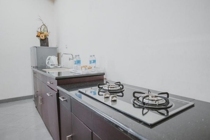 Imagen de la habitación del Hotel Reddoorz Premium @ Jalan Pal 10 Jambi. Foto 14