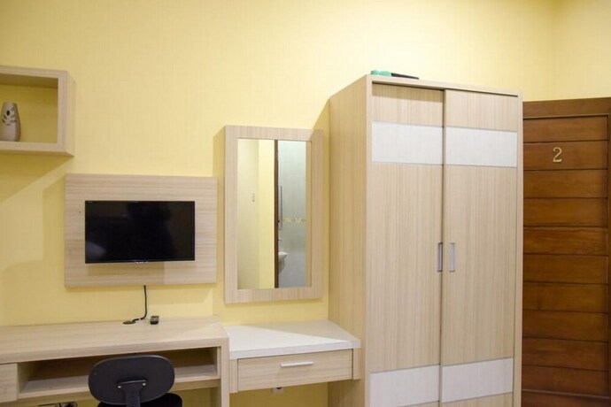 Imagen de la habitación del Hotel Reddoorz Syariah Near Jogja City Mall 2. Foto 28