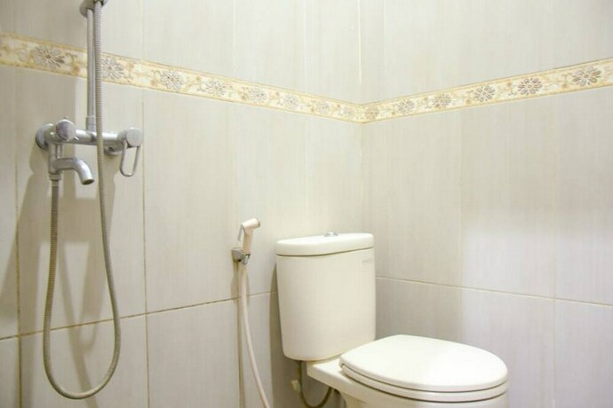 Imagen de la habitación del Hotel Reddoorz Syariah Near Jogja City Mall 2. Foto 29