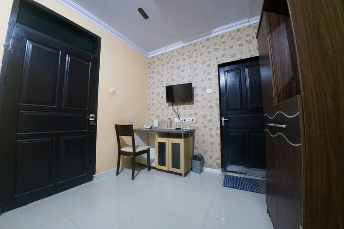 Imagen de la habitación del Hotel Reddoorz Syariah Near Rsud Ainun Habibie Gorontalo. Foto 31