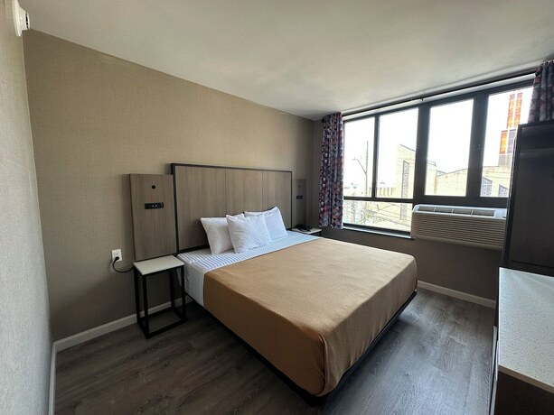 Imagen de la habitación del Hotel Regal Inn and Suites New York LaGuardia. Foto 15