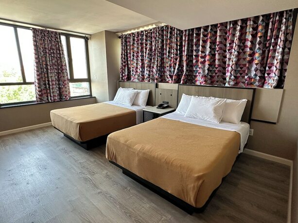 Imagen de la habitación del Hotel Regal Inn and Suites New York LaGuardia. Foto 16