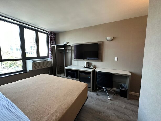 Imagen de la habitación del Hotel Regal Inn and Suites New York LaGuardia. Foto 17