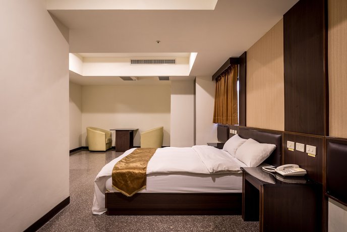 Imagen de la habitación del Hotel Regal International Hotel. Foto 7