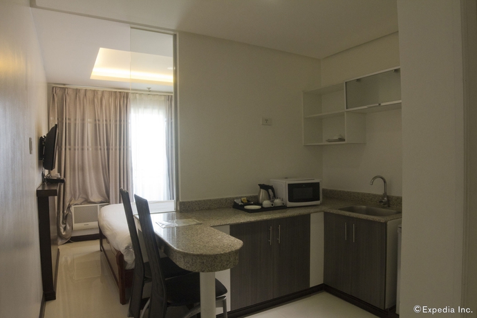 Imagen de la habitación del Hotel Regency Grand Suites. Foto 9