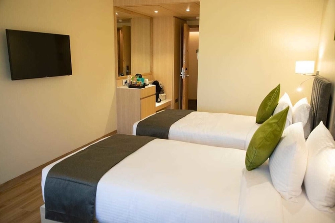 Imagen de la habitación del Hotel Regenta Central Harsha Vapi. Foto 5