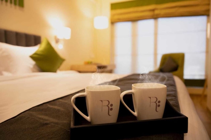 Imagen de la habitación del Hotel Regenta Central Harsha Vapi. Foto 7