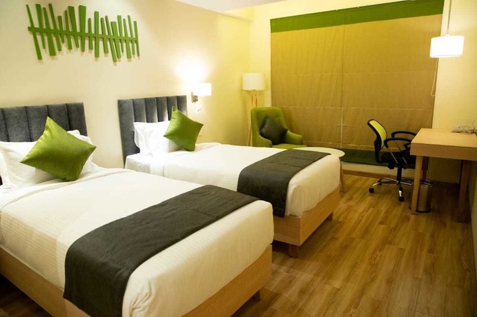 Imagen de la habitación del Hotel Regenta Central Harsha Vapi. Foto 12