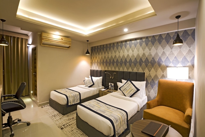 Imagen de la habitación del Hotel Regenta Central Noida. Foto 7