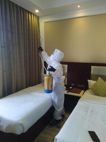 Imagen de la habitación del Hotel Regenta Inn Ranip Ahmedabad. Foto 12