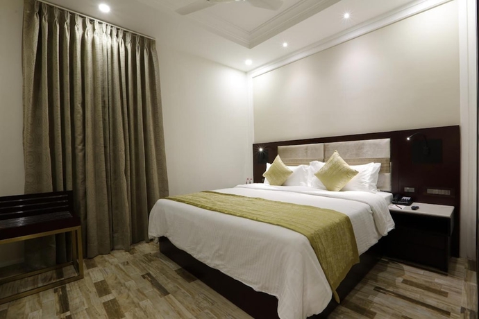 Imagen de la habitación del Hotel Regenta Inn Ranip Ahmedabad. Foto 19