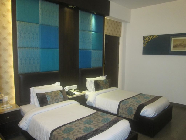 Imagen de la habitación del Hotel Regenta Orko's Haridwar. Foto 7