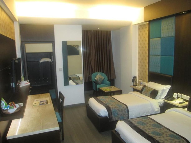 Imagen de la habitación del Hotel Regenta Orko's Haridwar. Foto 16