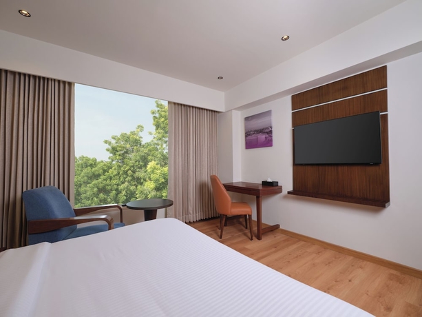 Imagen de la habitación del Hotel Regenta Place Ahmedabad. Foto 12