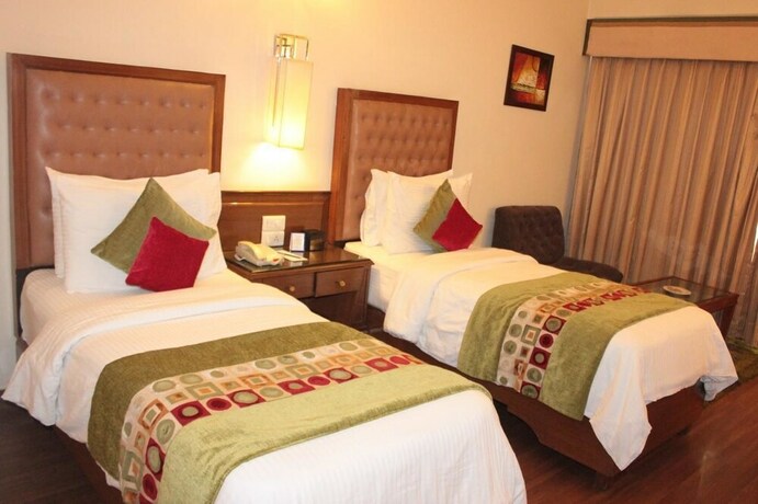 Imagen de la habitación del Hotel Regenta Place Amritsar. Foto 8