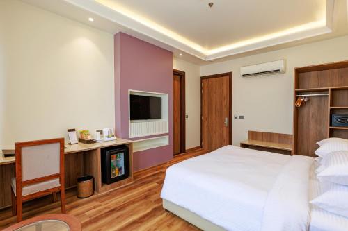Imagen de la habitación del Hotel Regenta Place Jaipur Sirsi Road, Opp Alankar PG College. Foto 19