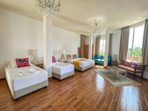 Imagen de la habitación del Hotel Rehendhi Villa. Foto 9