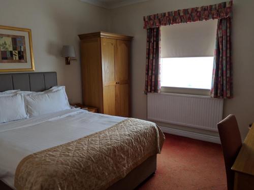 Imagen de la habitación del Hotel Reigate Manor Hotel. Foto 7