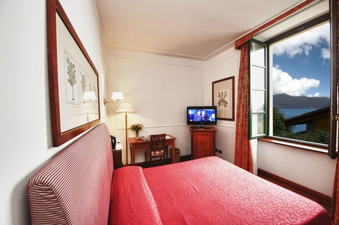Imagen de la habitación del Hotel Relais Casali Della Cisterna. Foto 16