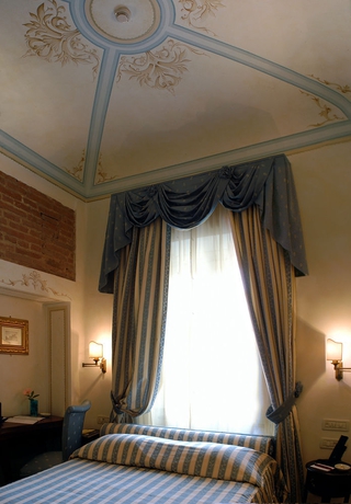 Imagen de la habitación del Hotel Relais Dell Orologio. Foto 5